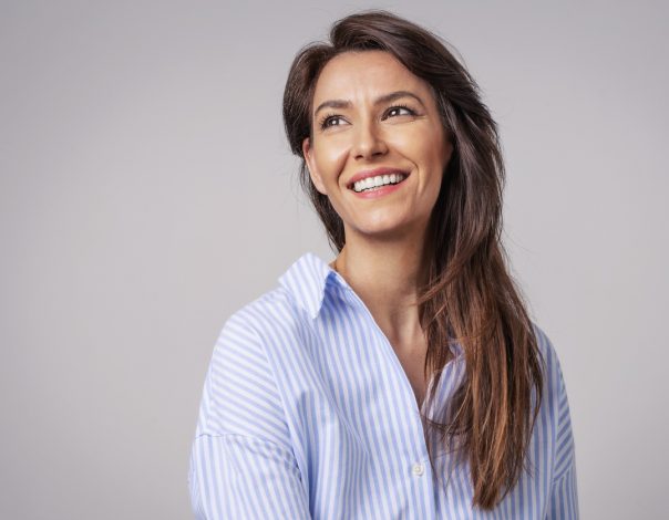 Woman in button up shirt smiling